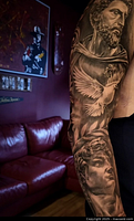 Black-and-grey realism full sleeve tattoo of classical sculptures, dove and ornamental elements
