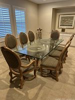 Full view of table with 8 chairs arranged.