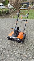 Full view of cordless snowblower with handle and body