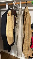 Four jackets hanging on rack