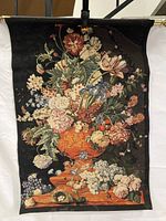 Full view of the antique French floral tapestry showing the complete woven floral and fruit scene with brass rod for hanging.