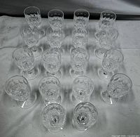 All 18 glasses grouped together on cloth