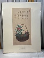 Full image of the Japanese watercolor print mounted on white mat board showing the floral basket, calligraphy, and minor corner wear.