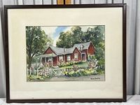 Framed watercolor painting of red farmhouse with surrounding trees and flowers.