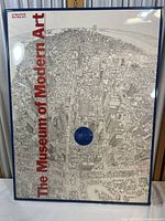 Full view of framed poster with detailed aerial illustration of New York, titled 'The Museum of Modern Art'.