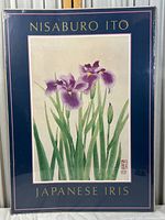 Framed vintage Japanese iris print by Nisaburo Ito showing botanical illustration of purple iris flowers and green stems.