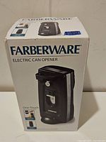 Boxed Farberware electric can opener front view showing brand name, product image and features.