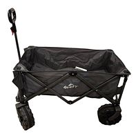 Full side view of the black folding fabric beach cart with metal frame and large plastic wheels on sand-compatible treads.