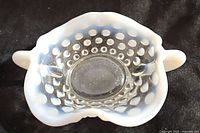 Top view showing the translucent moonstone opalescent edges with hobnail pattern and two handles.
