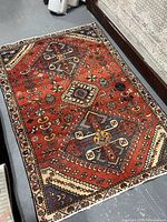 Full view of rug showing geometric pattern and border