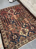 Full view of rug laid flat showing pattern and overall condition