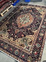 Full view of rectangular rug on concrete floor