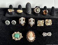 Front view showing rings, earrings, and brooches in display.