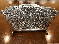 Front view of the pierced filigree panels and feet