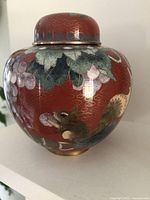 Front side of the ginger jar showing squirrel and grape motifs.