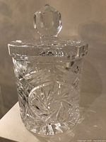 Front angle view of the crystal candy jar showing detailed cut-glass design and lid knob.
