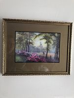 Full view of vintage watercolour painting with ornate gold-tone carved frame, showing a landscape scene with flowering bushes and trees.