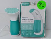 Arespark CS11 portable garment steamer with original box showing front side and model branding.