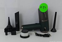 Cordless handheld vacuum cleaner and multiple cleaning attachments including brush, narrow nozzle, and filter with USB charging cable.