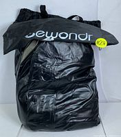 Black Lewondr branded drawstring carrying bag holding the air mattress in folded state.