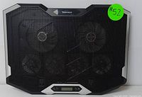 Top side view of black TopMate laptop cooling pad showing mesh surface with two large fans visible under the mesh and LCD control panel centered at bottom edge.
