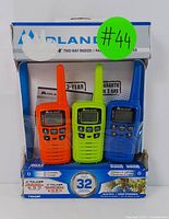 Three Midland X-Talker radios in box, showing front and packaging.