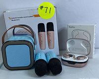 Karaoke speaker system including Model K12 speaker, two wireless microphones, and Rulefiss wireless earbuds with charging case arranged side by side.