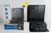 Overview of retail box, instruction manual, base station, robot and docking mat