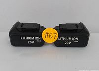 Front view of two black 20V lithium-ion batteries showing LITHIUM ION 20V MAX in white text.