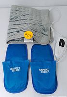 Gray quilted soft electric heating pad with attached white digital controller for adjustable heating.