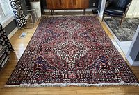 Full-view shot of the entire rug laid flat on hardwood floor