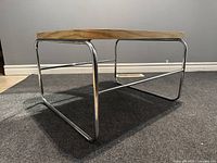 Angle view of vintage Artopex side table showing wood top and chrome frame