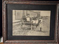 Framed black and white photograph depicting Butterworth children in a pony cart at Kipling, Saskatchewan in 1912, showing the entire frame and setting.
