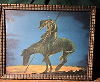 Front of framed art showing Native American figure on horse with spear against blue sky