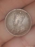 Obverse side showing King George V profile and inscription.
