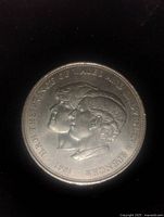 Obverse of coin showing profiles of Charles and Diana with inscription and date 1981.