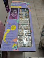 Boxed set of Easter Tree Decorations by Spatters showing front packaging and visible ornaments inside plastic window.