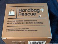 Front and top views of the gold-colored Handbag Rescue box showing branding, product details and item count