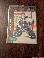 Front side of Felix Potvin 1992-93 Parkhurst NHL rookie card showing image of goalie in action with name and logo.