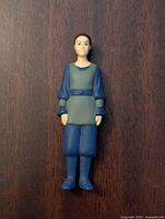 Front view of Star Wars Padme Amidala action figure in blue and gray outfit, showing detailed face, tunic, and boots.