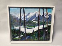 Framed acrylic painting showing snowy mountain landscape and pine trees with Mt. Norquay viewpoint theme.