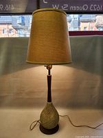 Full view of the lamp with shade showing overall height and shape.