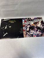 Top view of two vinyl record covers side by side: Thelonious Monk Greatest Hits and John Mayall Road Show Blues.