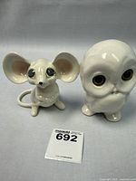 Full view of mouse and owl ceramic figurines side by side, showing size and condition.