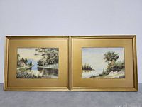 Closer frontal photo of pair of framed landscape watercolors with clear view of paintings and frames