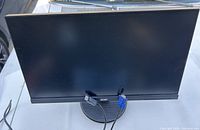 Front view of Acer 21-inch monitor with cables attached and visible stand