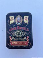 Top view of closed tin showing Jack Daniels Old No. 7 branding.