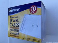 Photo showing sealed package of 10 Memorex standard CD jewel cases in clear plastic.