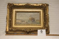 Full view of the ornate framed oil painting showing the hay harvest scene with several workers and horse-drawn wagon.