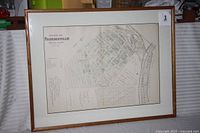 Framed and matted map is fully visible showing the complete framed presentation.
